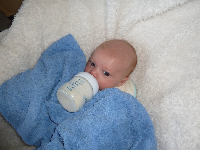 Poor, neglected third baby gets most of his bottles this way.