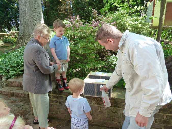 He's spraying them down with sugar water.